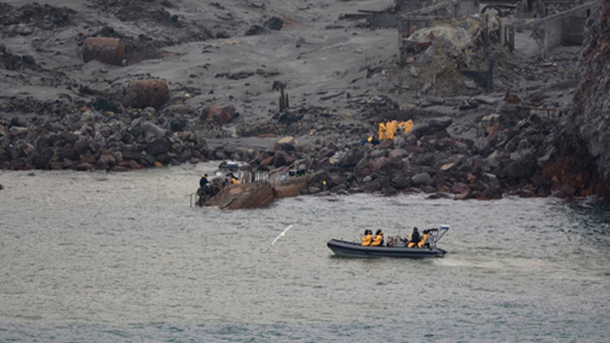 This photo released by the New Zealand Defence Force shows an operation to recover bodies from White Island after a volcanic eruption in Whakatane, New Zealand, Friday, Dec. 13, 2019. A team of eight New Zealand military specialists landed on White Island early Friday to retrieve the bodies of victims after the Dec. 9 eruption. (New Zealand Defence Force via AP)
