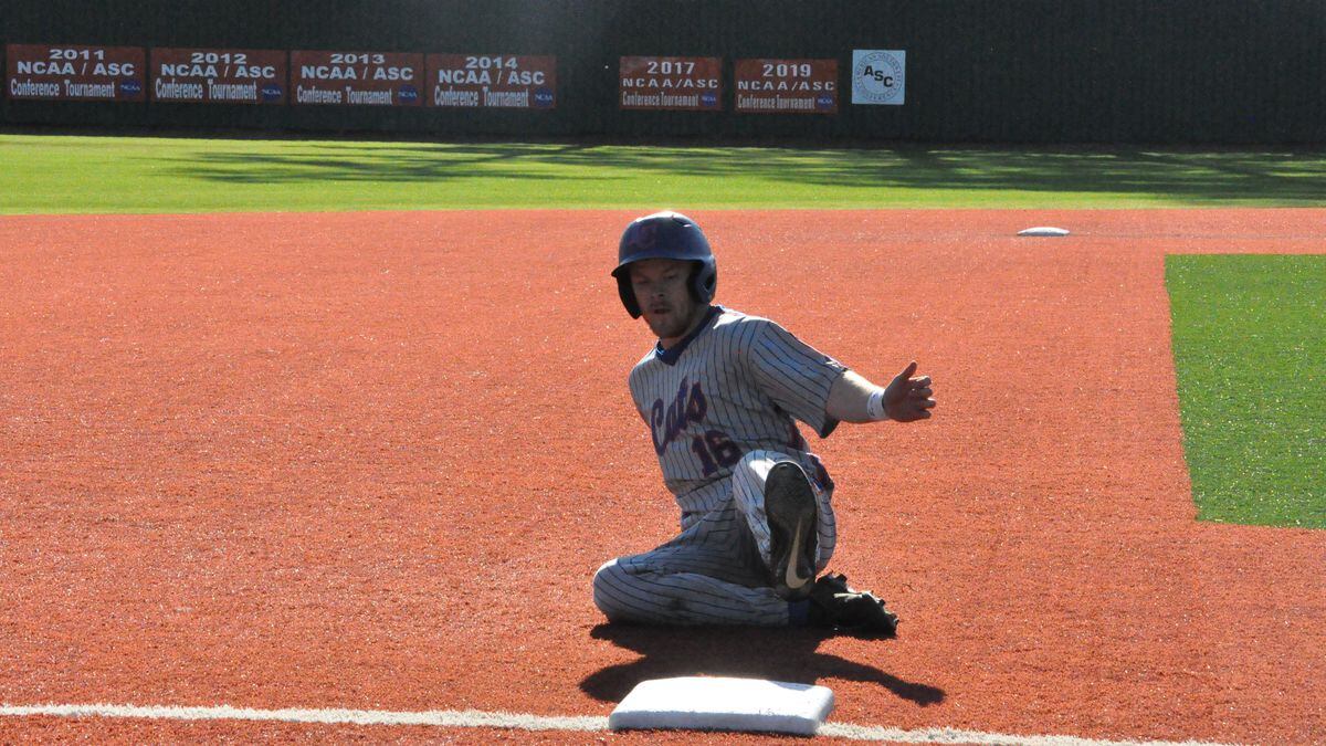 Sr. LF Christian Vandergrift sliding into third base Saturday against Alma. Credit: Darrell Brown/LC Sports Information