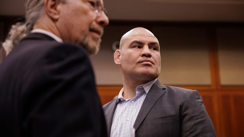 Cain Velasquez, right, appears for his arraignment with attorney Edward Sousa, who appeared...