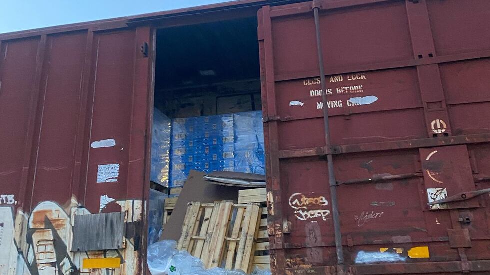 Photos released by police show what appear to be empty pallets on a train car, as well as the...