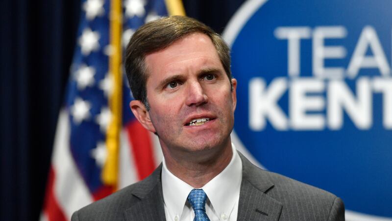 FILE - Kentucky Gov. Andy Beshear addresses reporters during a press conference in Frankfort,...