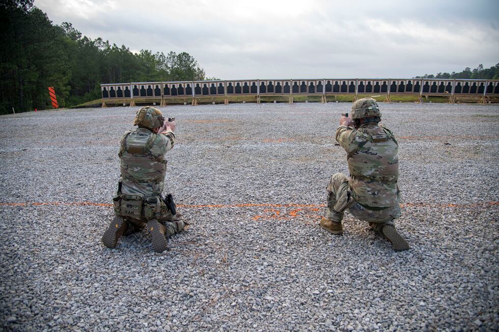 Louisiana National Guard Soldiers and Airmen compete during the Pistol Excellence in...