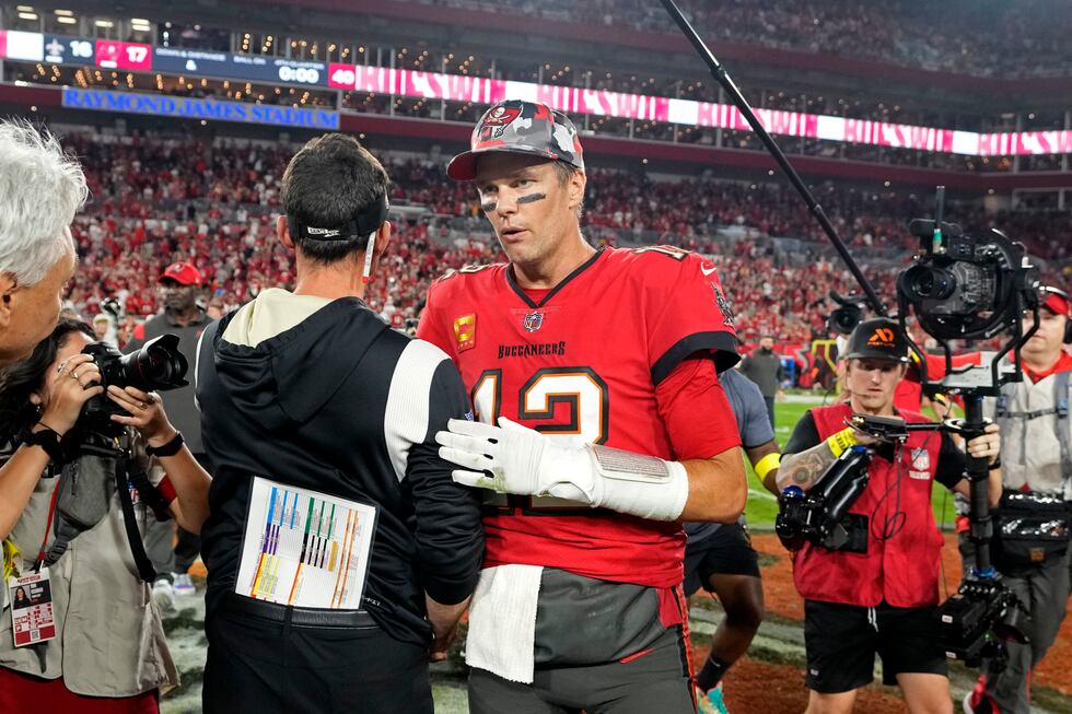 Tampa Bay Buccaneers quarterback Tom Brady (12) greets New Orleans Saints head coach Dennis...