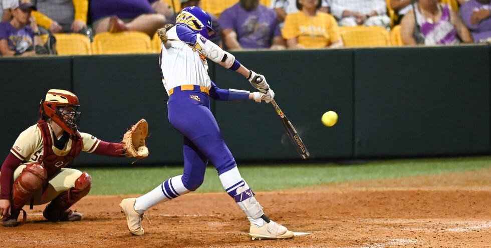 LSU shortstop Taylor Pleasants (17) hits a solo home run against Florida State in the NCAA...
