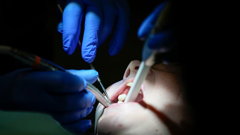 Danielle Wilkes is seen by a dentist during a clinic visit Thursday, Sept. 7, 2023, in...
