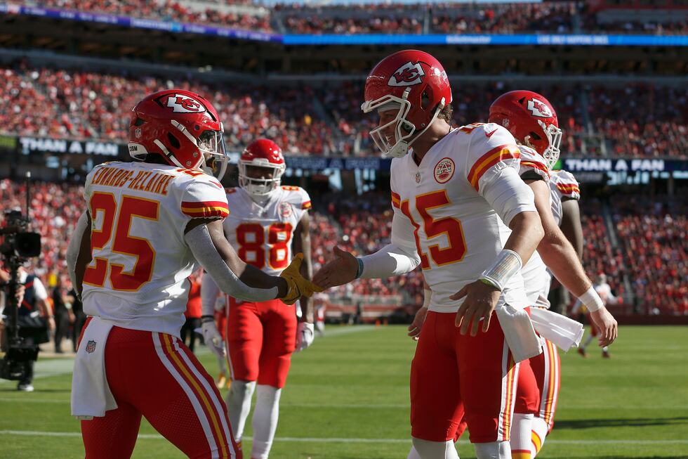 Kansas City Chiefs running back Clyde Edwards-Helaire (25) celebrates with quarterback Patrick...