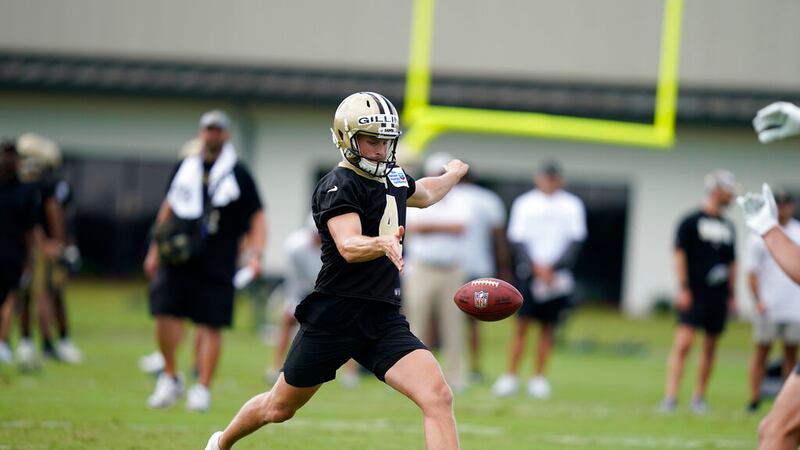 New Orleans Saints punter Blake Gillikin (4) runs through drills during training camp at their...