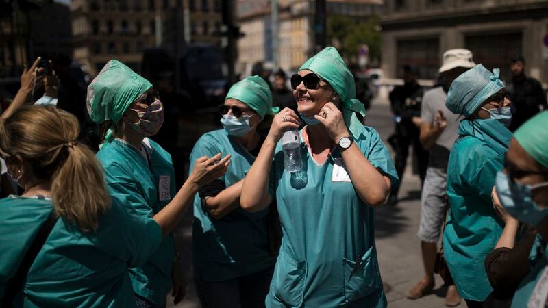 Medical workers attend a demonstration in Marseille, southern France, Tuesday, June 16, 2020....