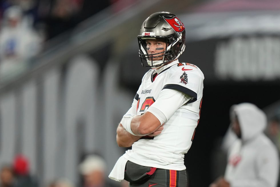 Tampa Bay Buccaneers quarterback Tom Brady (12) waits for his receivers to get into position...