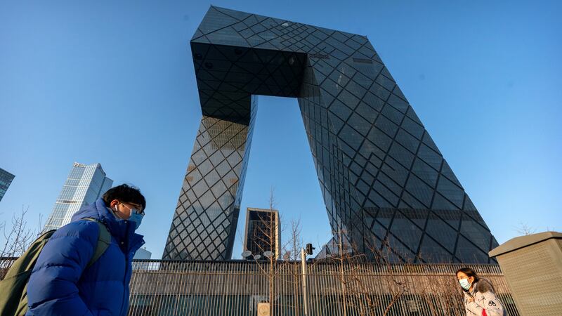 FILE- In this Thursday, Feb. 4, 2021 file photo, people wearing face masks to protect against...