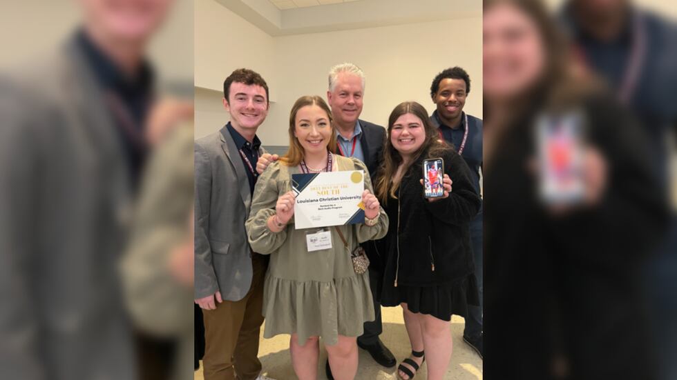 Journalism Professor Al Quartemont and his sports media students, Kai Stone, Brandon Brown,...