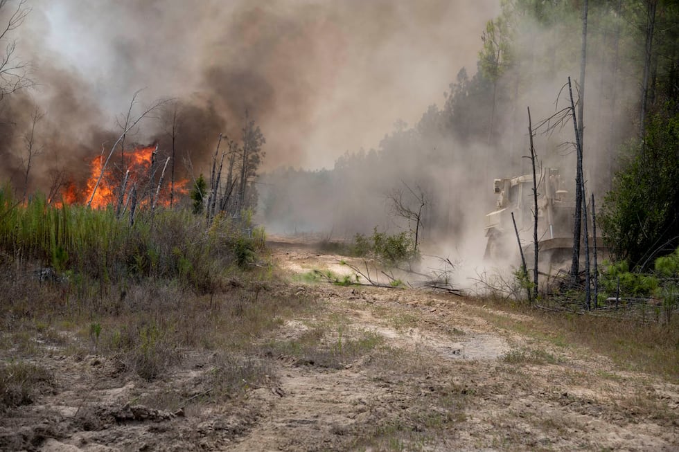 Soldiers from the Louisiana Army National Guard’s 528th Engineer Battalion use bulldozers to...