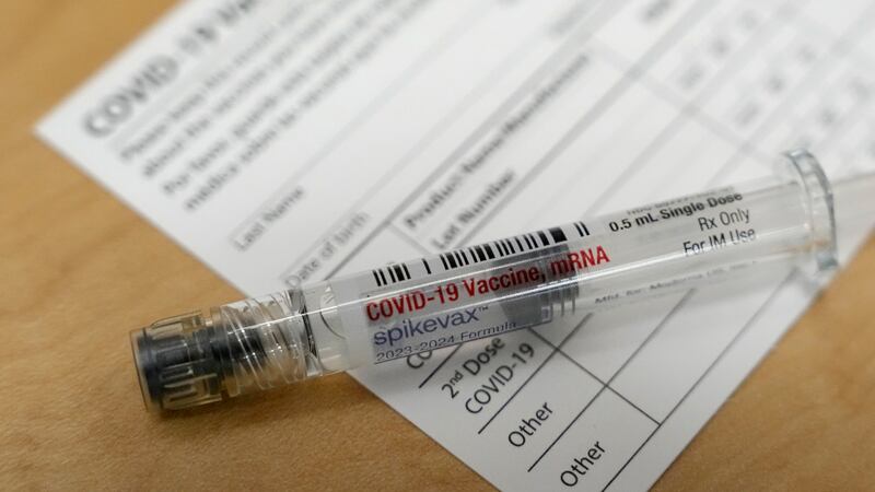 FILE - A Moderna Spikevax COVID-19 vaccine is seen at a drugstore in Cypress, Texas on...